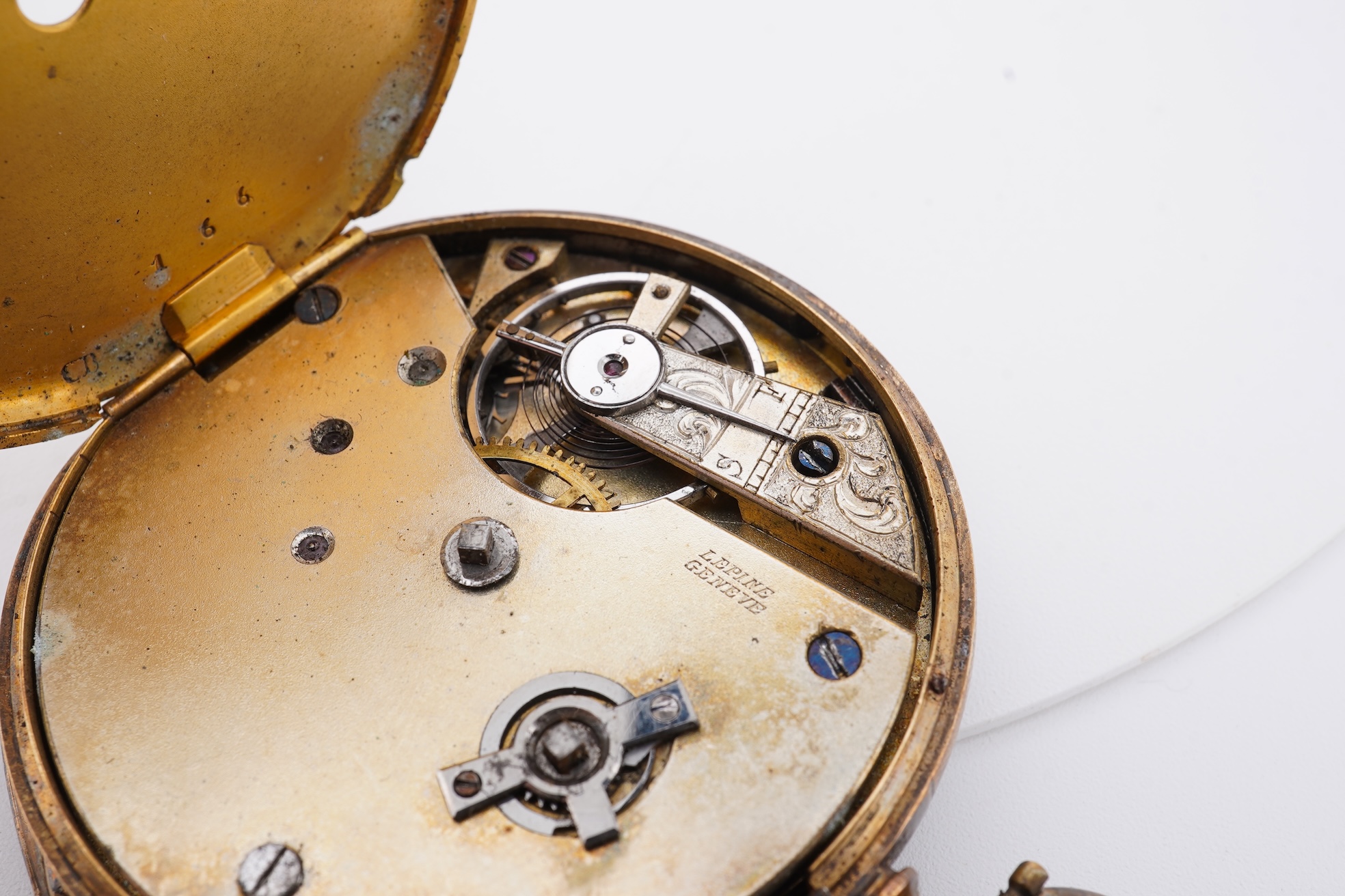 A damaged continental 18k lever pocket watch, together with a rolled gold pocket watch in similar condition.